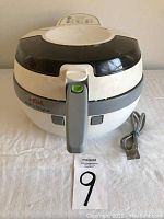 Front view of T-fal ActiFry Original Model Series 001 showing handle, lid, and power cord.