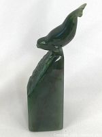 Right-front angled view of jade seal atop triangular base