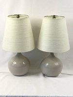 Front view of both lamps unlit showing shape and color