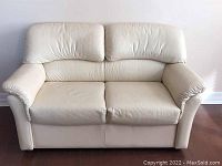 Front view of loveseat showing overall shape and surface