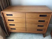 Front view of teak dresser