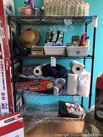 Photo showing the assembled metal rack with household items stored on it.