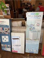 Photo showing boxed ClosetMaid Cubeicals organizer, Camden side table, and Extend-It shelving kit next to each other on a sofa.