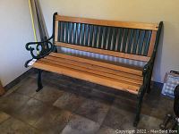 Full front view showing the bench frame and seat slats