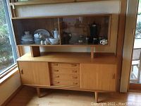 Full view of sideboard base and hutch against wall