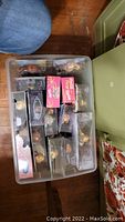 Top view of the collection box with multiple packaged dolls inside