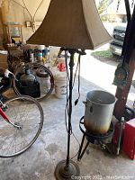 66-inch floor lamp with twisted metal stand and beige square fabric shade