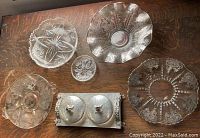 Photo shows six vintage glassware items including starburst cut glass bowl, sterling silver overlay bowls, and a double covered dish with floral handles.
