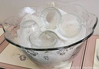 Large clear glass punch bowl, floral etched design, upside down punch glasses inside