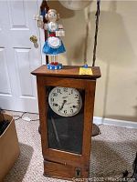 Wide view of entire lot showing wooden Simplex clock and Nutcracker figurine on top