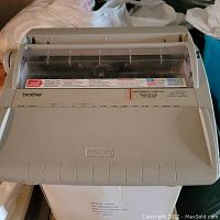 Front view of Brother GX 7750 typewriter showing model and branding.