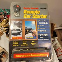 New sealed Ready Remote Deluxe remote starter system package showing remote fob and command module.