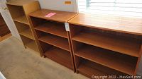 Photo of all three bookcases side by side showing their relative sizes and finishes.