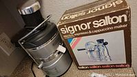Signor Salton electric espresso & cappuccino maker alongside its original box showing product image and model EX-3.