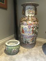 Front view showing large floor vase alongside small planter