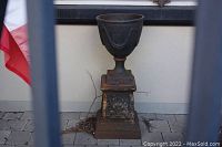 Front view showing full urn and pedestal