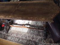 Top view of hardwood hall table showing scratches and wear marks to surface including water stains.
