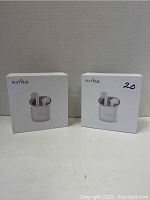 Two boxed HolyHigh Bluetooth earbuds shown side by side on a flat surface