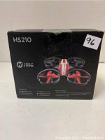 Front view of the Holy Stone HS210 Mini Drone box showing the drone image and branding details.