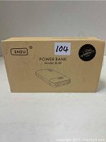 Beige cardboard box of Iniu power bank model BI-B5 with warranty label and product illustration.