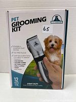 Front of the box showing Pet Union Pet Grooming Kit title and 12 pieces total including clippers and assorted grooming accessories for thin to medium coat pets.