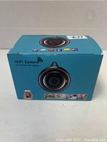 Front of the blue box shows the circular WiFi camera image and basic icons indicating features like network and video.