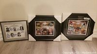 Photo showing all three framed Canadian Football Hall of Fame items leaning against wall on floor with protective corner covers on two frames