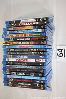 Stack of 20 Blu-ray movies titles visible on the spines including Cellular, The Day After Tomorrow, MacGruber, Fear the Walking Dead, Foxcatcher, 21 and Over, Freddy vs Jason, Covenant, Fifty Shades, Blade Runner 2049, others