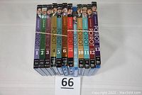 All 13 original Blu-ray series cases lined up vertically in order from series 1 to 13, showing full spine artwork including series number and main character images.