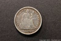 Obverse side of the 1873 U.S. Seated Liberty Half Dime showing the seated figure and date.