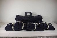 Overall view of all towel sets in navy blue color tied with ribbons