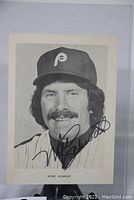 Black and white signed photographic print of Mike Schmidt, close-up view. Signed across the front in black ink. Slight bend noted at lower left corner.