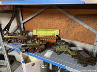 Entire lot showing two locomotives and four cars on shelf