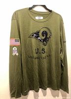 Front view of olive green long sleeve shirt showing LA Rams logo and U.S. text
