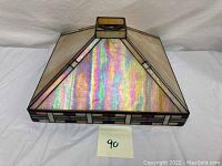 Top and side angled view of the square slag glass lamp shade showing the iridescent panels and decorative colored border.