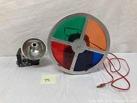 Full view of Kodak Brownie Hawkeye camera with large external flash and the rotating color wheel with power cord.