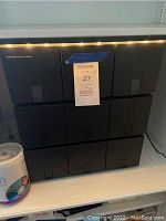 Six black ProFileo stackable CD storage units stacked in two rows of three units each with a MaxSold tag attached.