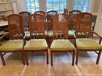 Front view of all eight chairs arranged in two rows in dining room