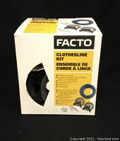 Box of FACTO Clothesline Kit showing product name and packaged contents with pulley and winch images