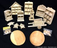 Overview of all items in lot including shelves, lighthouse, cart, turtles, round cutting boards, and wood pieces in bags.