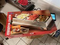 Box of Nostalgia 3 compartment buffet warmer with photo showing the warmer containing food compartments.