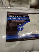 Photo showing the packaging of two Utopia brand pillow inserts with label information visible