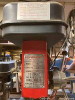 Front view of red head showing Foremost nameplate with model, capacity and spindle details