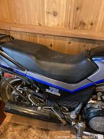 Rear section showing seat, luggage rack and V65 Sabre decal on side panel