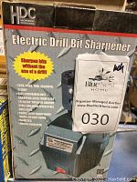 Box of Homer Electric Drill Bit Sharpener showing brand, specs, and features.