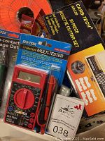 Photo of CEN-TECH multi-tester in packaging alongside rosette cutter set box and epoxy resin tube.