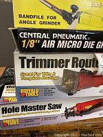 Box showing Buffalo Tools Hole Master Saw, Trimmer Router, Central Pneumatic Air Micro Die Grinder, and Bandfile for Angle Grinder