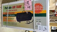 Photo of the sealed original packaging of a 10 gallon portable air tank showing brand, item name, and specifications including rust-free heavy gauge steel, automatic pressure bypass valve.
