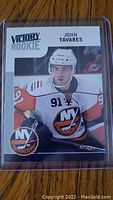 Front of the John Tavares 2009-10 Upper Deck Victory Rookie hockey card showing player image and team logo.