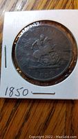 Front side of the 1850 Bank of Upper Canada One Penny coin showing a figure on horseback and the year 1850.